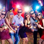 cheerful young company celebrates in a nightclub
